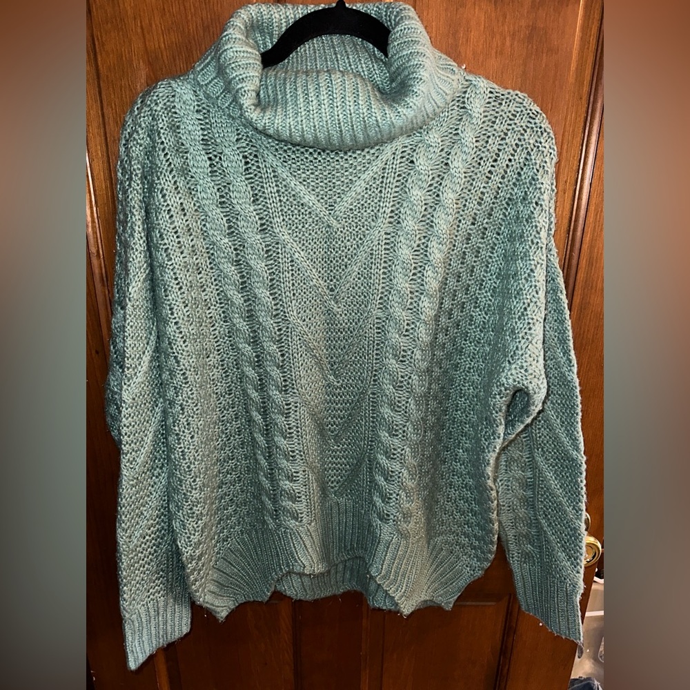 Green turtleneck sweater